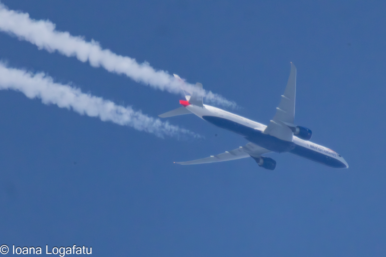 Jet soaring across the clear blue sky above